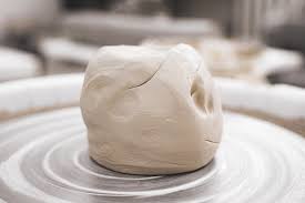 lump of clay on wheel, click more details to sign up for two hour introduction to clay class